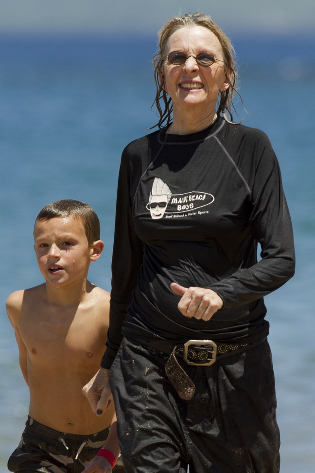 Diane Keaton, Maui Beach, black board shorts, black top, 
